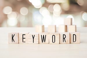 The work KEYWORD on wooden cubes background - SEO concept