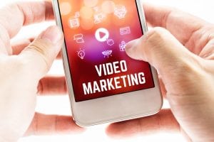 Cell Phone Showing Video Marketing with Video Play Button