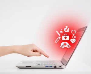 Laptop with someone looking at a medical website