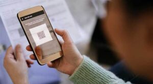 a person scanning a QR code with their phone