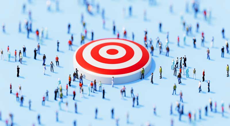 Crowd of people gathered around a red target symbol representing local search engine optimization